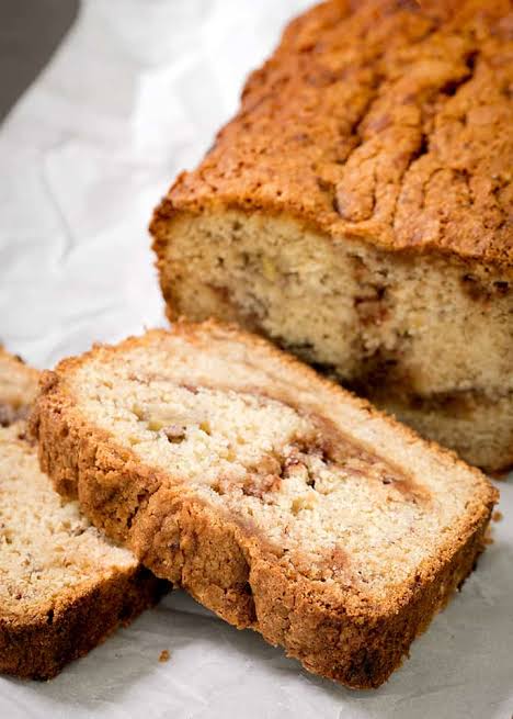 Freshly sliced flourless cinnamon swirl banana bread, AI generated