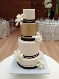 Black And Gold Wedding Cake Wedding Cake Black Ivory Gold White Flowers Jessica Mogardo Garces Catering Cake Desserts Cake Wedding Cakes