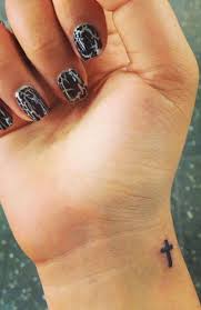 Why you don't try cross tattoos on wrist ? Simply Tiny Cross Tattoo On Girls Wrist