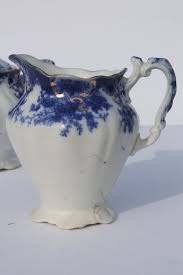 Maybe you would like to learn more about one of these? Antique Vintage Flow Blue China Serving Pieces Cream Pitcher Sugar Bowl Set