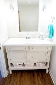 But the mirrors are oval and the circular vessel sinks sit on a floating vanity with wooden drawers. Diy Bathroom Vanity Ideas