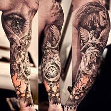Tribal sleeve christian tattoo on man sleeve. Christian Tattoo Ideas