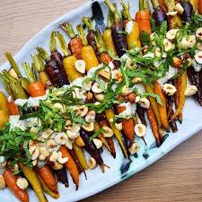 Roasted Carrots With Mint Hazelnuts And Creamy Lemon Tahini Sauce On Feedfeed Dinner Party Recipes Vegetarian Recipes Food
