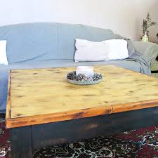Crafted with a black frame, the top and shelf are finished to have the appearance of reclaimed wood. Diy Refurbished Wood Coffee Table The Boondocks Blog