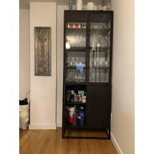 #cratestyle find more for the fam: Crate Barrel Casement Black Tall Cabinet Aptdeco
