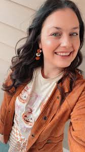 Fall festival outfit ideas with pumpkin accessories