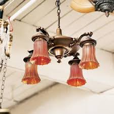 Use a bent piece of coat hanger to hang the fixture from the box in order to support it. Buying And Using Vintage Light Fixtures This Old House
