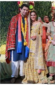 Pakistani Bride At Her Mehendi Henna Party In Yellow Gharara Pakistani Wedding Dresses Mehendi Outfits Pakistani Dresses