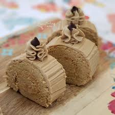 Inspired by the classic pinoy flavors of ube and quezo filled with delectable mantecado buttercreme. Mocha Roll