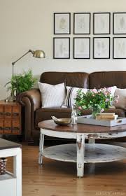 You can go either with a table with brown leather top finish or a coffee table with brown leather leg such as this lovely glasstop table. 10 Beautiful Brown Leather Sofas