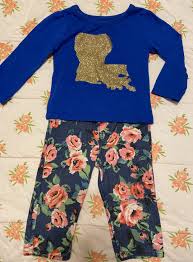 Comes in navy with a classic collar. Louisiana Top And Floral Jeggings Set