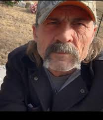 Thinking I have been told yet another lie. So he is at work in a shop,  sitting down