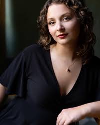 Next we have our violin I of our Amabile String Quartet, Danielle Szabo who  will be performing selections of Vaughn Williams' On Wenlock Edge. Danielle  Szabo is a professional violinist and vocalist