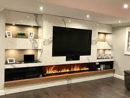 Such big screens will just look awkward above the mantel. Bottom Continuation Of Fireplace Living Room With Fireplace Fireplace Design Living Room Tv Wall
