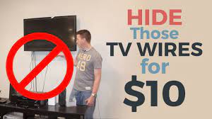 The easiest way to conceal the wires or cords without going through the wall is by using a flat panel tv cord cover kit. How To Hide Your Tv Wires For 10 Youtube