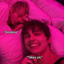 Colby Taking Pictures with Sam While Sam Is Sleeping