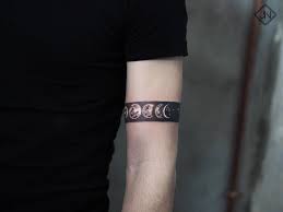 Moon Phases Armband Tattoo On The Left Upper Arm Arm Band Tattoo Band Tattoo Designs Sleeve Tattoos