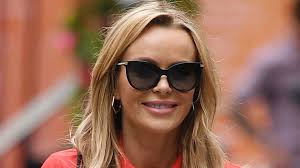Amanda Holden gets hearts racing in corset style mini dress