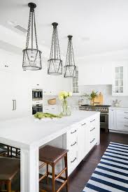 iron chain and glass island lights