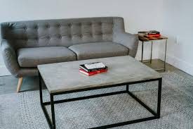 Handcrafted from concrete, wood and steel, this dining room table measuring 90 in length x 42 wide x 30 tall was created by combining hickory wood and natural gray concrete. Diy Modern Concrete Coffee Table John Malecki