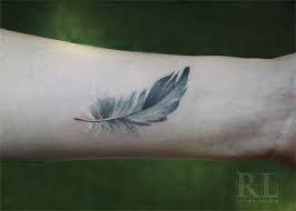 Pin By Heather Shonk On Beauty Is Skin Deep More Ink Feather Tattoos White Feather Tattoos Feather Tattoo Wrist