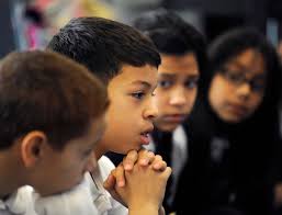 Students handwrite their hopes for President Obama