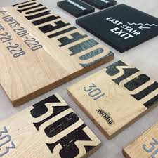 Nothing says unique like custom wood branding designed just for you by a professional designer. Custom Wood Ada Signs Outfield Lofts By Ideation Signs