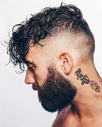 Men S Undercut Haircut Wavy Hair Men Undercut Men Hair And Beard Styles