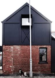 The design team painted the brick exterior white to unify the finishes, adding black trim for a preppy east coast vibe. Red Brick Houses With Black Trim Design Indulgence