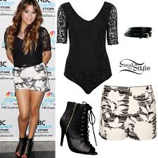 She is looking at her dress hanging on the wall. Ally Brooke Lace Boydsuit Floral Shorts Steal Her Style