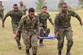 Members of the Rwanda Defence Force litter carry a