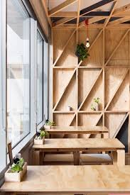 Australian Prison Converted Into A Cafe With Colourful Gridded Walls Cafe Interior Plywood Interior Cafe Design