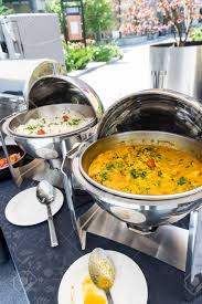 London broil with herb butter. Live Food Stations Kitchenware In The Line Catering Summer Brunch Buffet Food Luxury Hotel Outdoor Outside Garden By The Pool Al Fresco Restaurant Corporate Cocktail Event Party Warm Food Stations Stock Photo Picture