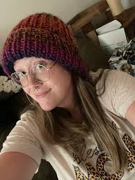 First doll. Necklace and skirt are crocheted. Some of it made up by me. Hat  was a pattern by Michele Jack from this site and I learned to do fair isle  to