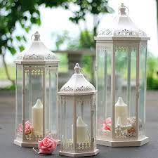 These tall tapered candle holders can hold 3 single candles. European Outdoor Floor Iron Candlestick Lantern Home Decoration Hollowed Candle Holders Transparent Glass House Candle Holders Candle Holders Aliexpress