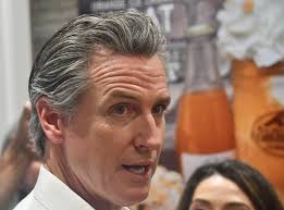 California governor urges faith in Biden during Granite State stops