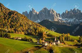 St. Magdalena Or Santa Maddalena With Its Characteristic Church In Front Of  The Geisler Or Odle Dolomites Mountain Peaks In The Val Di Funes Valley  (Villnoesstal) In Italy In Autumn. Stock Photo,