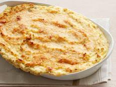 Place them in a large bowl and add 2 cups heavy cream, 2 cups grated gruyere cheese, 1 teaspoon kosher salt and 1/2 teaspoon ground black pepper. Ina Garten Bobby Flay Potato Gratin