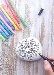 How To Draw A Mandala Rock Painting Tutorial From Artistro Paint Pen Pebble Painting Ideas Mad Rock Painting Supplies Rock Painting Tutorial Painted Rocks Diy