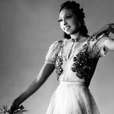 Known as la baker in her adopted france, josephine was a worldwide celebrity and devoted civil rights activist who first rose to fame by dancing in a skirt of artificial bananas and very little. Great Outfits In Fashion History Josephine Baker In A Glam Dress With A Bunch Of Cookies Fashionista