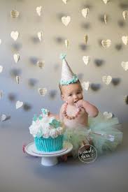 The baby usually proceeds to smash the cake into bits, hence the name… A Musical First Birthday Cake Smash Saratoga Springs Boston Baby Photographer Nicole Starr Photography