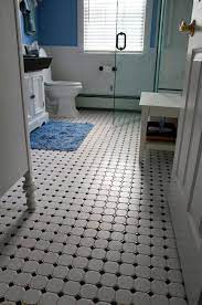 This black and white tile flooring has a bold pattern and a distressed look with the etched lines throughout. Black Bathroom Floor Tile Ideas Decoomo