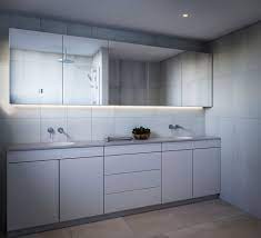 Two toned kitchen cabinetry includes blue shaker cabinets with brass pulls and white shaker cabinets with oil rubbed bronze pulls. Mirror Cabinet Doors By Glassic Glassic Doors