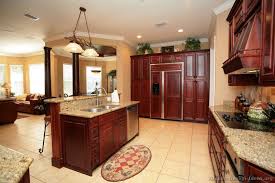 Galley Kitchen Dark Cherry Cabinets Panel For Fridge And Range Hood Traditional Dark Wood Cher Mahogany Kitchen Kitchen Design Cherry Wood Kitchen Cabinets