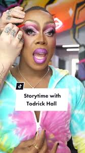 Drag Queen in Blonde Wig Telling Story