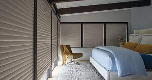 Soft sheers on a rustic iron rod hang over woven grass shades and gently filter light into the room. Top Bedroom Window Treatment Ideas Hunter Douglas
