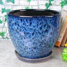 Many designs available from plant stands to hanging plant pots and large planters. Amazon Com Ceramic Home Garden Modern Fashion Large Flower Planter Pot With Saucer Tray Outside Peacock Pattern Garden Outdoor