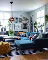 Modern Black And White Rug Living Room A Graphic Black And White Striped Rug Grounds The Seating Area In This Cozy Colorful Living Room Interior Design Living Room Living Room Designs Living Decor