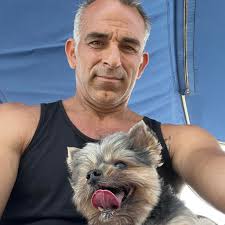 Can a spouse of an LLC owner be hired to captain a bareboat chartered  pontoon boat?