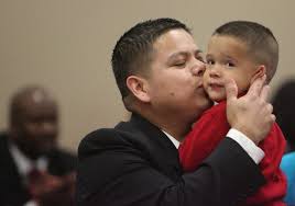 18 families adopt 33 children